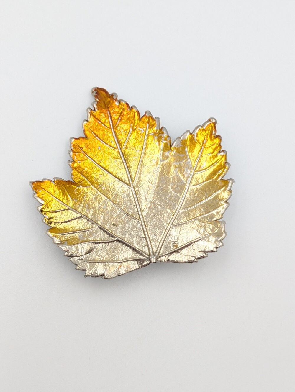 Silver tone and enamel maple leaf brooch pin